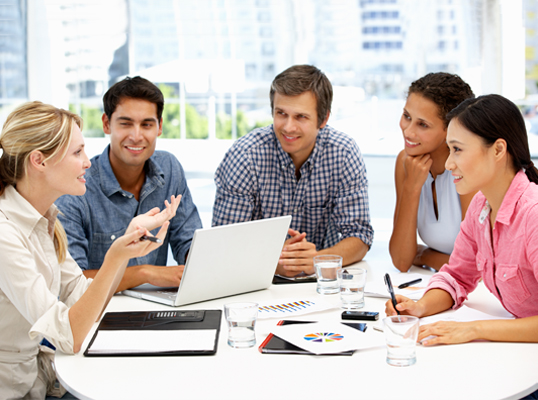 employees meeting around a table in a office