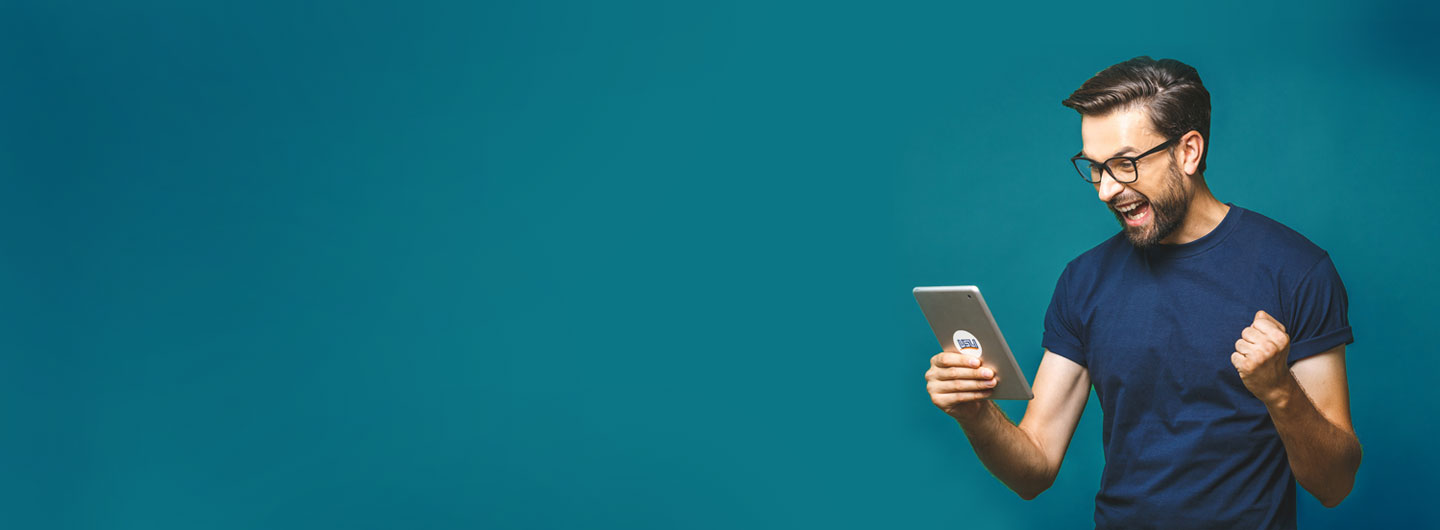man excitied looking at tablet